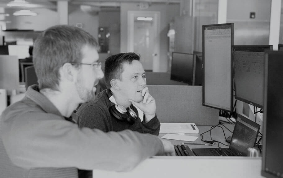 engineers looking at monitor